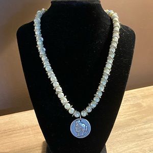 Artisan pearl and silver medallion necklace.